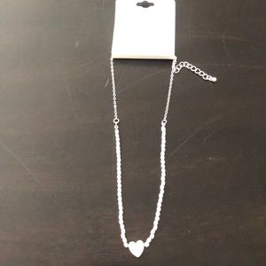 Silver tone heart necklace and earring set